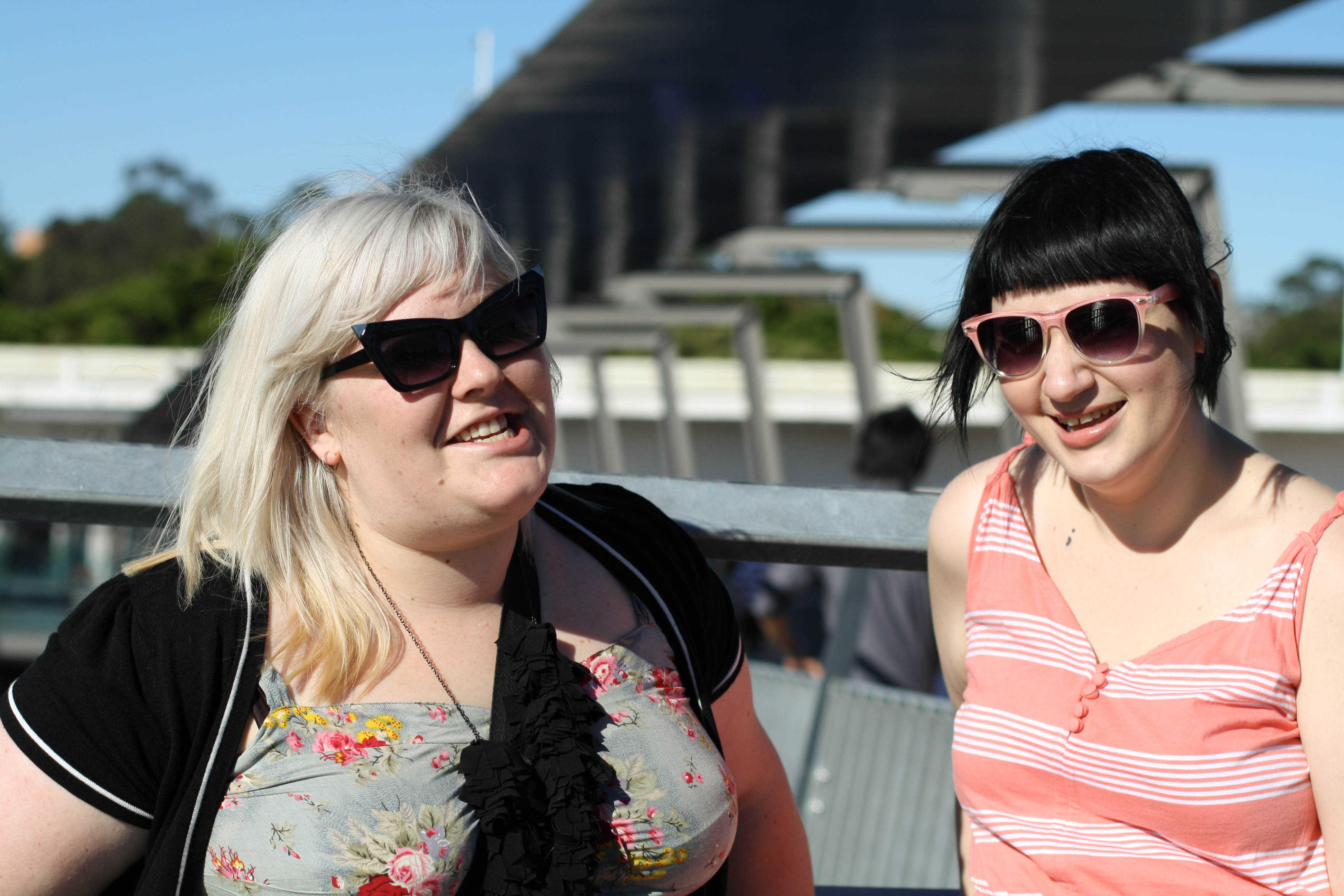 Photo of Zoe and Sonya on the bridge, laughing.