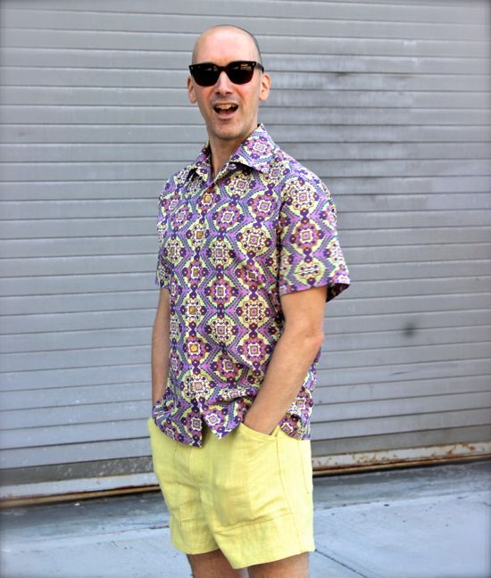 Peter Lappin of Male Pattern Boldness modelling a purple patterned short sleeve shirt.